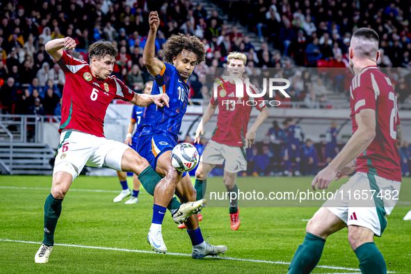 Hungary defender Willi Orban and Netherlands forward Joshua Zirkzee are present during the match between Hungary and the Netherlands at the...