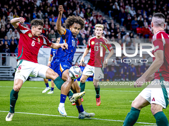 Hungary defender Willi Orban and Netherlands forward Joshua Zirkzee are present during the match between Hungary and the Netherlands at the...