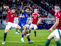 Hungary defender Willi Orban and Netherlands forward Joshua Zirkzee are present during the match between Hungary and the Netherlands at the...