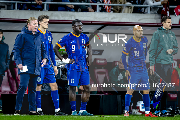 Netherlands trainer Ronald Koeman, Netherlands forward Brian Brobbey, and Netherlands forward Donyell Malen are present during the match bet...