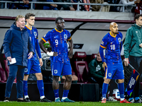 Netherlands trainer Ronald Koeman, Netherlands forward Brian Brobbey, and Netherlands forward Donyell Malen are present during the match bet...