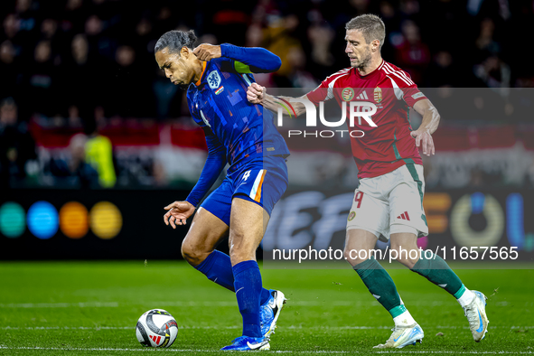 Netherlands defender Virgil van Dijk and Hungary forward Barnabas Varga play during the match between Hungary and the Netherlands at the Pus...