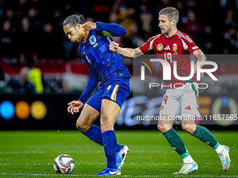 Netherlands defender Virgil van Dijk and Hungary forward Barnabas Varga play during the match between Hungary and the Netherlands at the Pus...