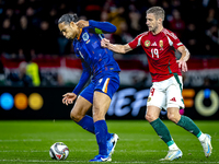 Netherlands defender Virgil van Dijk and Hungary forward Barnabas Varga play during the match between Hungary and the Netherlands at the Pus...