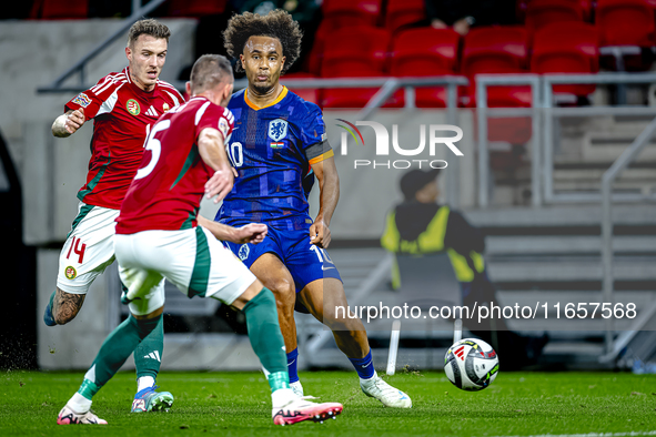 Netherlands forward Joshua Zirkzee and Hungary defender Bendeguz Bolla play during the match between Hungary and the Netherlands at the Pusk...