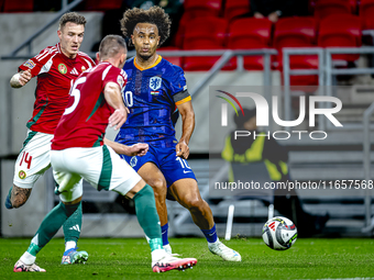 Netherlands forward Joshua Zirkzee and Hungary defender Bendeguz Bolla play during the match between Hungary and the Netherlands at the Pusk...