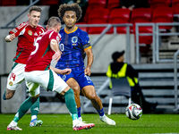 Netherlands forward Joshua Zirkzee and Hungary defender Bendeguz Bolla play during the match between Hungary and the Netherlands at the Pusk...