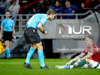 Referee Lukas Fahndrich and Hungary defender Bendeguz Bolla participate in the match between Hungary and the Netherlands at the Puskas Arena...