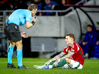 Referee Lukas Fahndrich and Hungary defender Bendeguz Bolla participate in the match between Hungary and the Netherlands at the Puskas Arena...