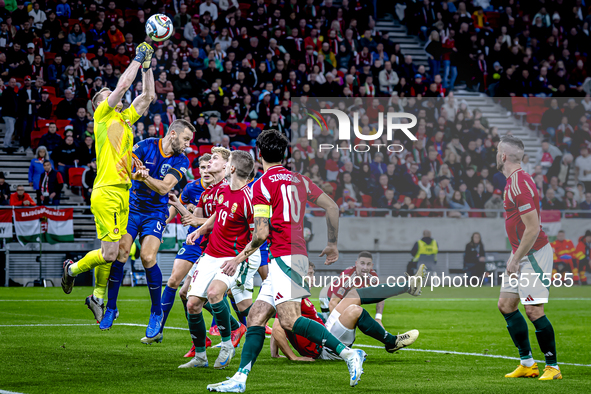 Hungary goalkeeper Denes Dibusz and Netherlands defender Stefan de Vrij participate in the match between Hungary and the Netherlands at the...