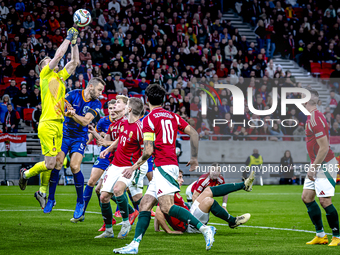 Hungary goalkeeper Denes Dibusz and Netherlands defender Stefan de Vrij participate in the match between Hungary and the Netherlands at the...