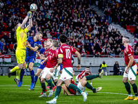 Hungary goalkeeper Denes Dibusz and Netherlands defender Stefan de Vrij participate in the match between Hungary and the Netherlands at the...