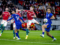 Hungary defender Endre Botka and Netherlands forward Joshua Zirkzee are present during the match between Hungary and the Netherlands at the...