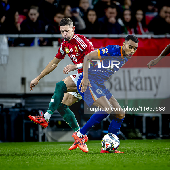 Hungary midfielder Zsolt Nagy and Netherlands midfielder Ryan Gravenberch play during the match between Hungary and the Netherlands at the P...