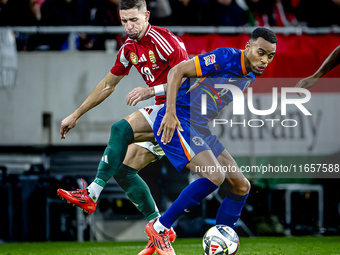 Hungary midfielder Zsolt Nagy and Netherlands midfielder Ryan Gravenberch play during the match between Hungary and the Netherlands at the P...