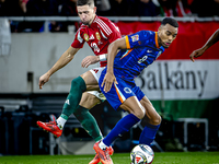 Hungary midfielder Zsolt Nagy and Netherlands midfielder Ryan Gravenberch play during the match between Hungary and the Netherlands at the P...