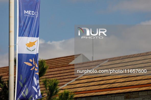 A banner of the event is seen in Paphos, Cyprus, on October 11, 2024. The 11th Summit of the Southern EU Countries (MED9) takes place in Pap...