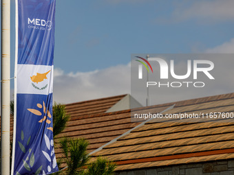 A banner of the event is seen in Paphos, Cyprus, on October 11, 2024. The 11th Summit of the Southern EU Countries (MED9) takes place in Pap...