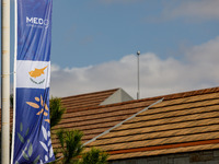 A banner of the event is seen in Paphos, Cyprus, on October 11, 2024. The 11th Summit of the Southern EU Countries (MED9) takes place in Pap...