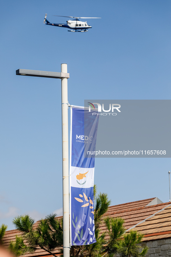 A police helicopter is seen over the area in Paphos, Cyprus, on October 11, 2024. The 11th Summit of the Southern EU Countries (MED9) takes...