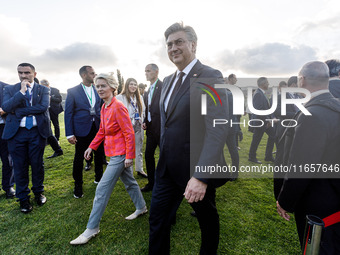 President of the European Commission Ursula von der Leyen and Prime Minister of Croatia Andrej Plenkovic leave the family photo area in Paph...