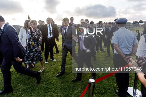 President of France Emmanuel Macron and Portugal Minister of Foreign Affairs Paulo Rangel leave the family photo area in Paphos, Cyprus, on...