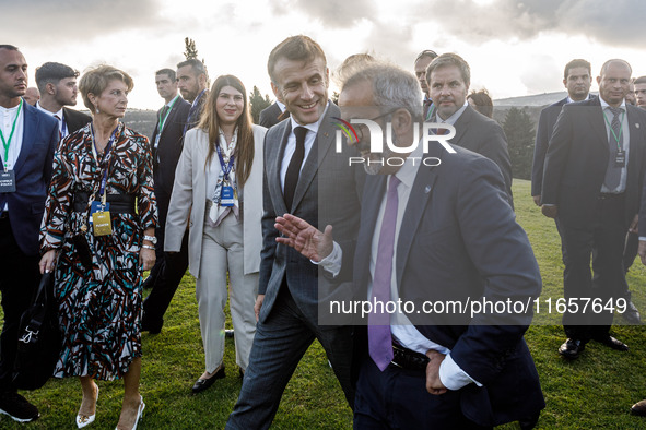 President of France Emmanuel Macron and Portugal Minister of Foreign Affairs Paulo Rangel leave the family photo area in Paphos, Cyprus, on...