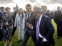 President of France Emmanuel Macron and Portugal Minister of Foreign Affairs Paulo Rangel leave the family photo area in Paphos, Cyprus, on...