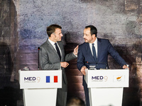 President of France Emmanuel Macron and President of Cyprus Nikos Christodoulides talk before the press conference in Paphos, Cyprus, on Oct...