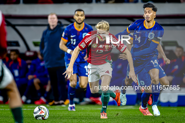 Hungary midfielder Andras Schafer and Netherlands midfielder Tijani Reijnders play during the match between Hungary and the Netherlands at t...