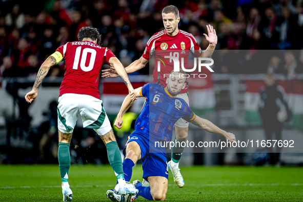 Hungary midfielder Dominik Szoboszlai, Netherlands defender Stefan de Vrij, and Hungary forward Barnabas Varga participate in the match betw...