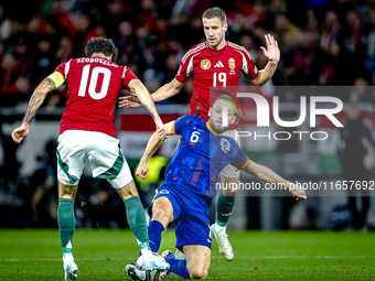 Hungary midfielder Dominik Szoboszlai, Netherlands defender Stefan de Vrij, and Hungary forward Barnabas Varga participate in the match betw...