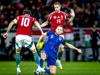 Hungary midfielder Dominik Szoboszlai, Netherlands defender Stefan de Vrij, and Hungary forward Barnabas Varga participate in the match betw...