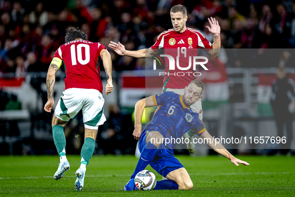 Hungary midfielder Dominik Szoboszlai, Netherlands defender Stefan de Vrij, and Hungary forward Barnabas Varga participate in the match betw...