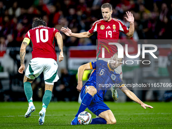 Hungary midfielder Dominik Szoboszlai, Netherlands defender Stefan de Vrij, and Hungary forward Barnabas Varga participate in the match betw...