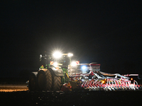 FONTENAY-LE-PESNEL, FRANCE - OCTOBER 11: 
A tractor John Deere 6250R pulls the AEROSEM POTTINGER pneumatic seed drill through a field near F...