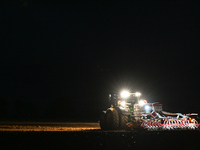 FONTENAY-LE-PESNEL, FRANCE - OCTOBER 11: 
A tractor John Deere 6250R pulls the AEROSEM POTTINGER pneumatic seed drill through a field near F...