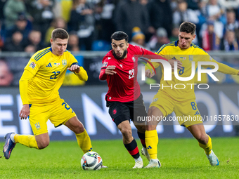 Mykola Matviyenko, Georges Mikautadze and  Georgiy Sudakov are playing  during the  UEFA Nations League 2024 League B Group B1 match between...