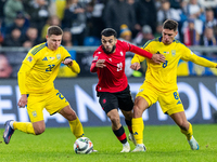 Mykola Matviyenko, Georges Mikautadze and  Georgiy Sudakov are playing  during the  UEFA Nations League 2024 League B Group B1 match between...