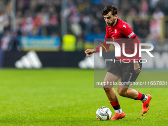 Khvicha Kvaratskhelia is playing  during the  UEFA Nations League 2024 League B Group B1 match between Ukraine and Georgia , at the Poznan A...