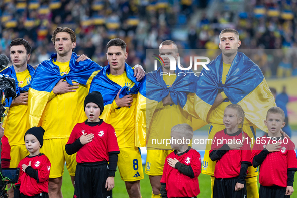 Mykola Shaparenko, Oleksii Hutsuliak, Georgiy Sudakov, Mykhailo Mudryk and Artem Dovbyk stand during national anthem the  UEFA Nations Leagu...