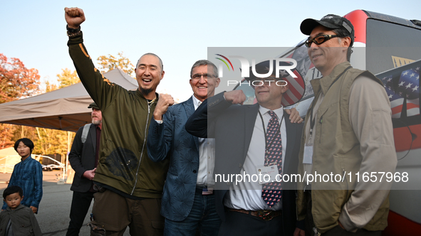 Michael Flynn, Justin Moon, Sean Moon at the annual Rod of Iron Festival in Greeley, Pennsylvania, on October 11, 2024, where a showing of t...