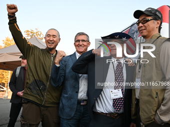 Michael Flynn, Justin Moon, Sean Moon at the annual Rod of Iron Festival in Greeley, Pennsylvania, on October 11, 2024, where a showing of t...