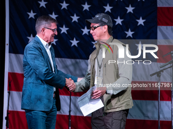 Michael Flynn, Justin Moon at the Rod of Iron Festival in Greeley, Pennsylvania, on October 11, 2024, where a showing of the documentary ''F...