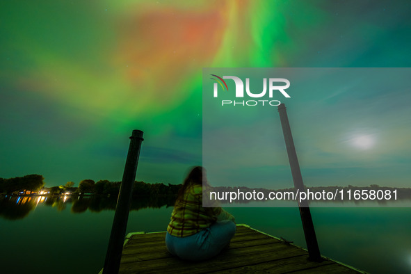 The Aurora Borealis, or Northern Lights, is visible over Chisago City, Minnesota, due to a major geomagnetic storm and heightened solar acti...