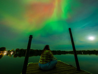 The Aurora Borealis, or Northern Lights, is visible over Chisago City, Minnesota, due to a major geomagnetic storm and heightened solar acti...