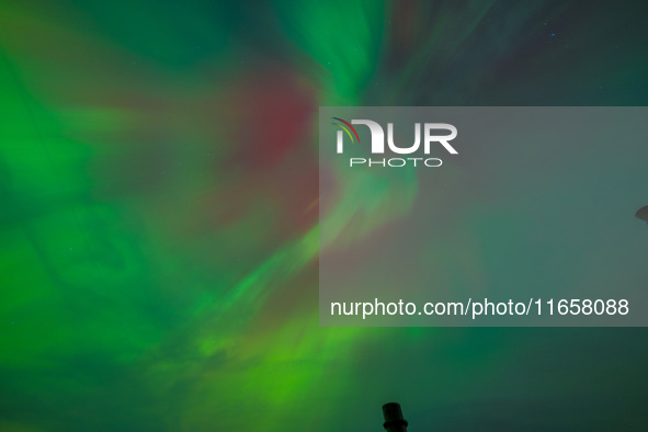 The Aurora Borealis, or Northern Lights, is visible over Chisago City, Minnesota, due to a major geomagnetic storm and heightened solar acti...