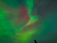 The Aurora Borealis, or Northern Lights, is visible over Chisago City, Minnesota, due to a major geomagnetic storm and heightened solar acti...