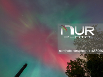 The Aurora Borealis, or Northern Lights, is visible over Chisago City, Minnesota, due to a major geomagnetic storm and heightened solar acti...