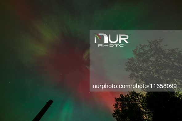 The Aurora Borealis, or Northern Lights, is visible over Chisago City, Minnesota, due to a major geomagnetic storm and heightened solar acti...